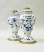 A pair of Meissen onion pattern blue and white inverted pear shaped oil lamp bases with brass