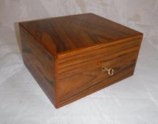 A Dunhill walnut veneered humidor containing various cigars including three Macanudo Jamaica No.