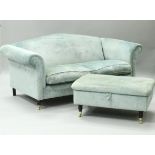 A pair of modern aquamarine upholstered scroll arm three seat sofas on turned front legs to brass