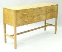 An early to mid 20th Century oak sideboard attributed to Heal's,
