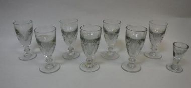 Set of seven late 18th/early 19th century wine glasses, with cut decoration to the bowl,
