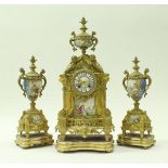 A 19th Century French gilt metal cased clock garniture,