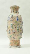 A 19th Century Chinese polychrome decorated vase, decorated in relief with household objects,