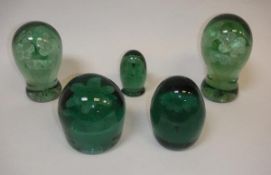 Five Victorian glass dump paperweights, each with flower decoration,