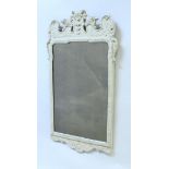 A pair of 19th Century cream painted gesso wall mirrors in the 18th Century manner,
