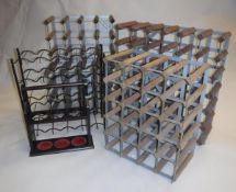 Five various small wine racks and a modern three bottle stand or tantalus