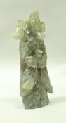 A Chinese carved jadeite figure of female form holding blossom and vase, 19.