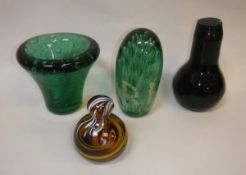 A Victorian green glass dump paperweight of baluster form,