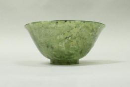 A carved jade Chinese bowl of translucent form, 10.5 cm x 4.