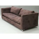 A pair of Alcantara fabric wine coloured three seat sofas on aluminium square supports,