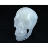 A quartz carving of a human skull made from one piece of crystal,
