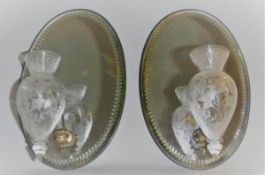 A pair of 19th Century mirrored back wall sconces,