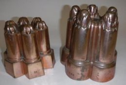 Two Victorian copper jelly moulds, one with five column decoration, stamped "388",