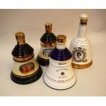 Four bottles Bell's Old Scoth Whisky including pottery bell-shaped bottle To Commemorate The 60th