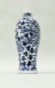 A Chinese blue and white baluster shaped vase decorated with two four toed dragons amongst