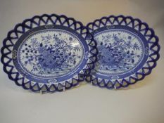A pair of 19th Century blue and white transfer decorated oval ribbon plates,