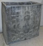An early 18th Century lead cistern, the front dated "1720",