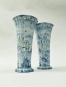 A pair of 19th Century faience vases of ribbed trumpet form,