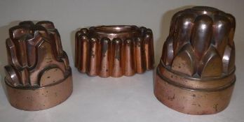 Three Victorian copper jelly moulds to include a mould stamped "22", 17.