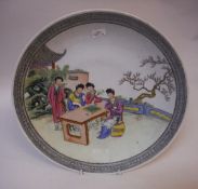 A Chinese polychrome decorated charger,