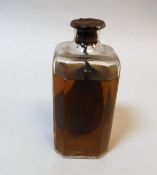 A vintage un-named bottle containing a preserved pear (possibly "Poire William"),