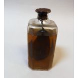 A vintage un-named bottle containing a preserved pear (possibly "Poire William"),