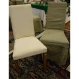 A set of fourteen modenr upholstered dining chairs with loose covers