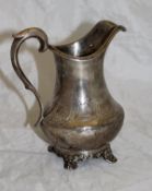 A Victorian silver baluster shaped jug with engraved decoration (London 1844) approx 6.