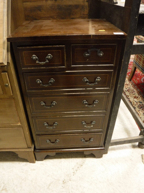 A pair of walnut bedside cabinets with single drawers above cupboard doors to cabriole legs,