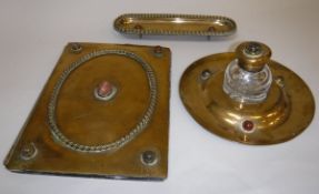 A Victorian brass desk set comprising blotter,