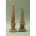 A near-matching pair of rose quartz obelisks