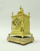 A 19th Century gilt brass mantle clock of pagoda form and scrolling foliate decoration,