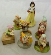 A Royal Doulton Disney Showcase collection of a figure group of Snow White and the Seven Dwarfs to