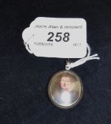 A 19th Century white metal mounted miniature depicting a gentleman with a full head of hair and a