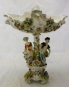 A late 19th Century Sitzendorf table centre with shaped bowl and floral encrusted decoration on a