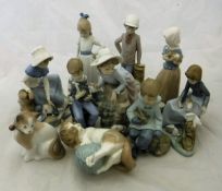 A collection of ten Lladro figurines of children and kittens