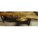 A yew wood plank topped bench