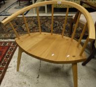A modern beech and ash stick back chair with wide and shaped seat on turned tapering legs
