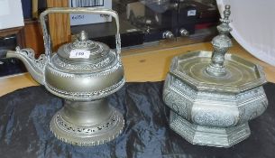 An Indian brass teapot and lidded octagonal pot, the lid with four feet to the base,