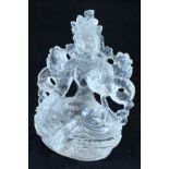A carved single piece of rock crystal as Tara meditating,