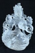 A carved single piece of rock crystal as Tara meditating,