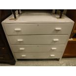 A mid 20th Century white painted chest of four long drawers