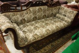 A William IV mahogany framed scroll arm sofa with shell carved and shaped top rail,