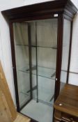 A Victorian stainedc pine shop display cabinet with single door and adjustable shelving
