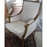 A pair of oak framed arm chairs in the Louis XVI taste, cream upholstered,