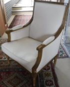 A pair of oak framed arm chairs in the Louis XVI taste, cream upholstered,