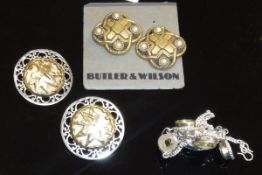 A box containing two pairs of vintage Butler & Wilson clip on earrings and a citrine set necklace