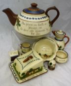 A collection of Devon Motto ware to include a large teapot marked "No place on earth so pleases me