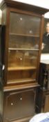 A Victorian mahogany bookcase cabinet of slim proportion,