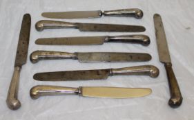 A box containing assorted silver pistol grip handled knives of various sizes,